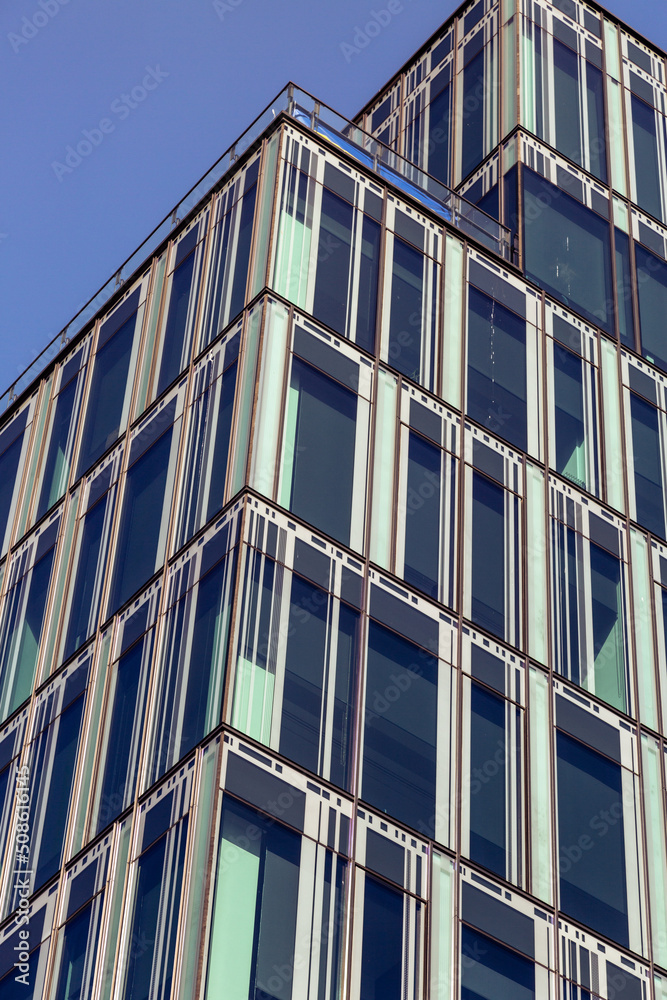 Skyscraper. Skyscraper against the blue sky. Glass and metal building, office and business center in a large city. Modern architecture. Skyscraper. Skyscraper against the blue sky. Glass and metal building, office and business center in a large city. Modern architecture.