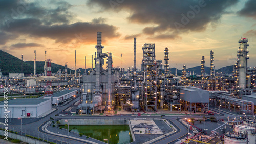 Oil and gas refinery plant form industry zone at night, Aerial view oil and gas Industrial petrochemical fuel power and energy.