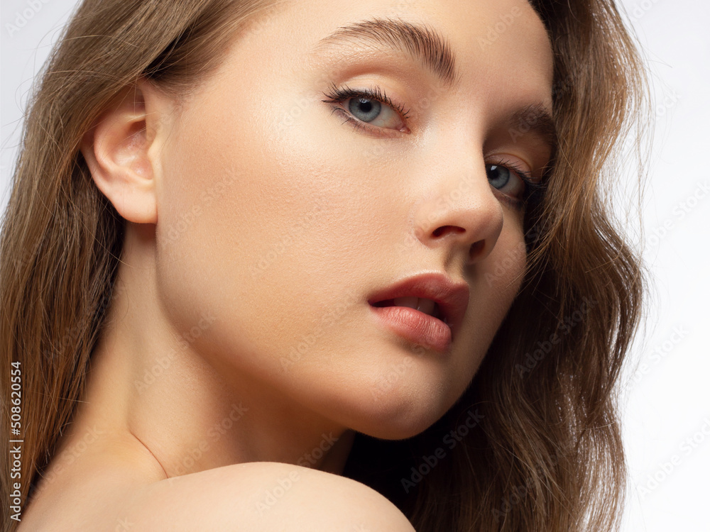 Closeup of beauty woman with clean shiny skin and natural cosmetics. Beautiful extrem eyelash and plump lips of a well-groomed girl demonstrate spa procedures, injections in a beauty parlor Closeup of beauty woman with clean shiny skin and natural cosmetics. Beautiful extrem eyelash and plump lips of a well-groomed girl demonstrate spa procedures, injections in a beauty parlor
