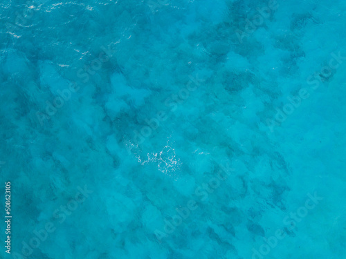 Turquoise ocean water pattern (aerial drone photo). Seychelles