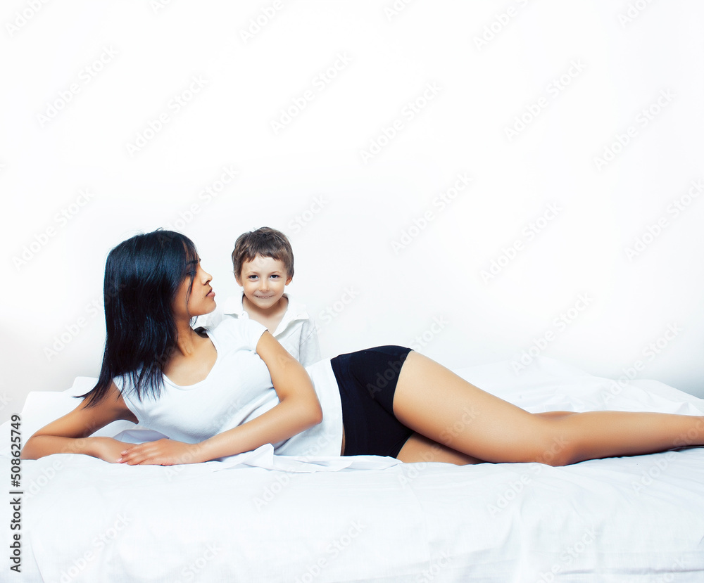 cute little boy in bed with mother in pajamas having fun happy smiling, lifestyle people concept cute little boy in bed with mother in pajamas having fun happy smiling, lifestyle people concept