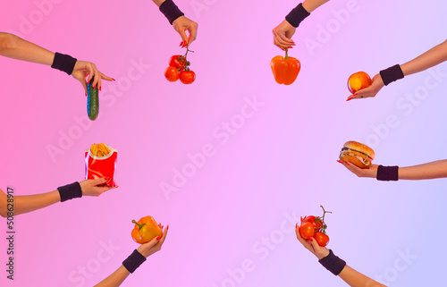 Photo for advertising about diet, nutrition, fitness and sports. Social media post idea. Hands with burgers from fast food and vegetables.