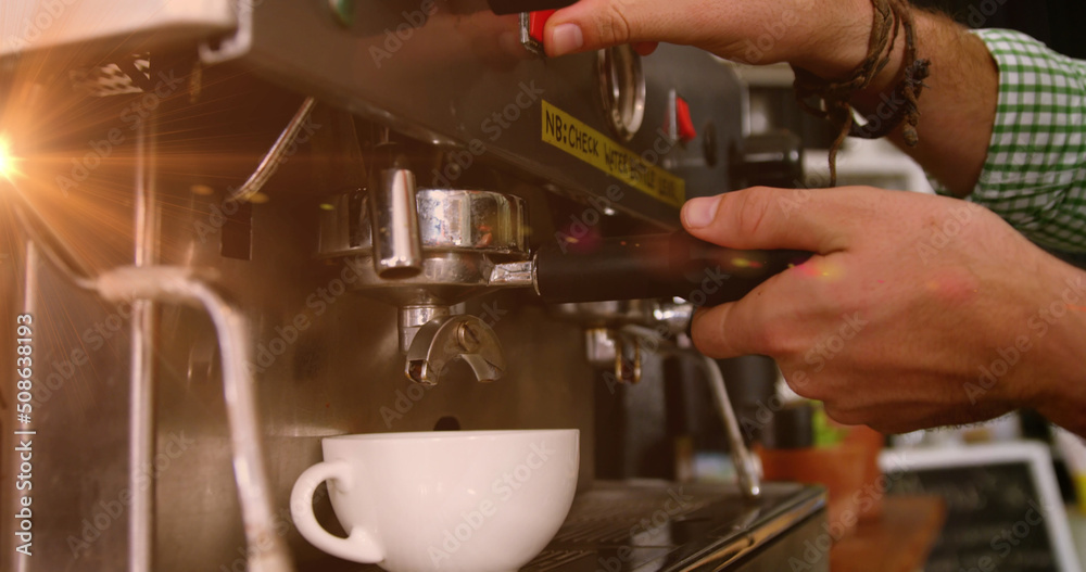 Image of light spots over biracial man using coffee machine Image of light spots over biracial man using coffee machine