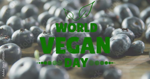 Image of world vegan day text over fresh blueberries