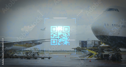 Image of a blue QR code over an airplane taking off
