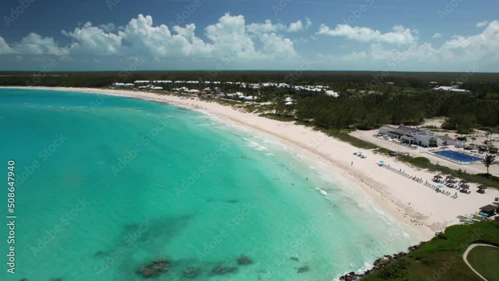 Aerial View Of Scenic Resort With White Sand Beach And Turquoise Ocean In Bahamas - drone shot Aerial View Of Scenic Resort With White Sand Beach And Turquoise Ocean In Bahamas - drone shot