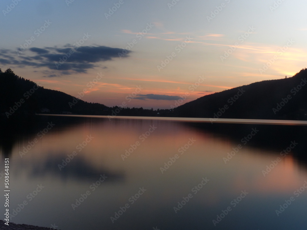 Fototapeta premium Gerardmer - August 2020 : Visit of the city of Gerardmer - Tour of the beautiful lake in the middle of the Vosges mountains with an August sunset