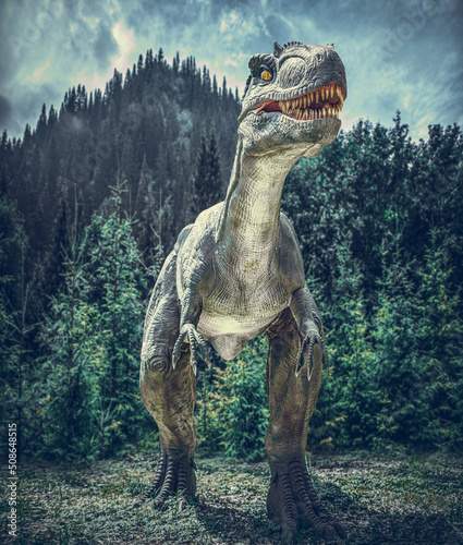 Dinosaur on the background of a gloomy forest. © Denis Rozhnovsky