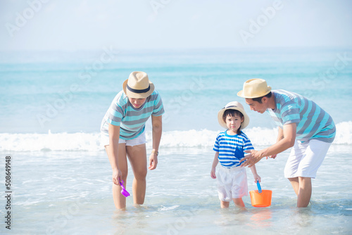 Happy family enjoy together on the beach ,Parent with daughter  having fun on summer vacation , Travel summer holiday  vacation  lifestyle Concept.
