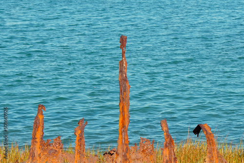 Sea wall ruins on coast of Squantum MA USA photo