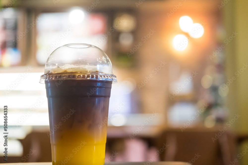 Iced coffee mixed with orange juice, two tones layer Iced coffee mixed with orange juice, two tones layer