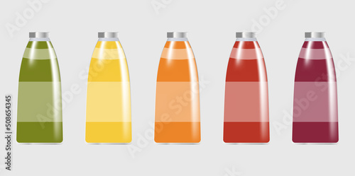 set of glass bottles with juice. five bottles with different colors of juice