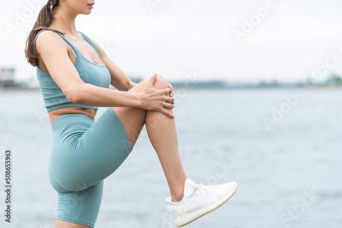Photos Beautiful athlete stretching hamstring and hip flexor in yoga pose