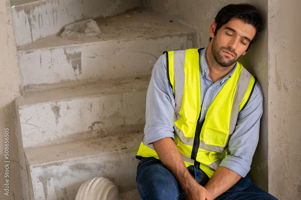 Civil engineers are tired from working in the hot sun. has come to sleep in the building that is under construction sleeping on the stairs of the building Civil engineers are tired from working in the hot sun. has come to sleep in the building that is under construction sleeping on the stairs of the building