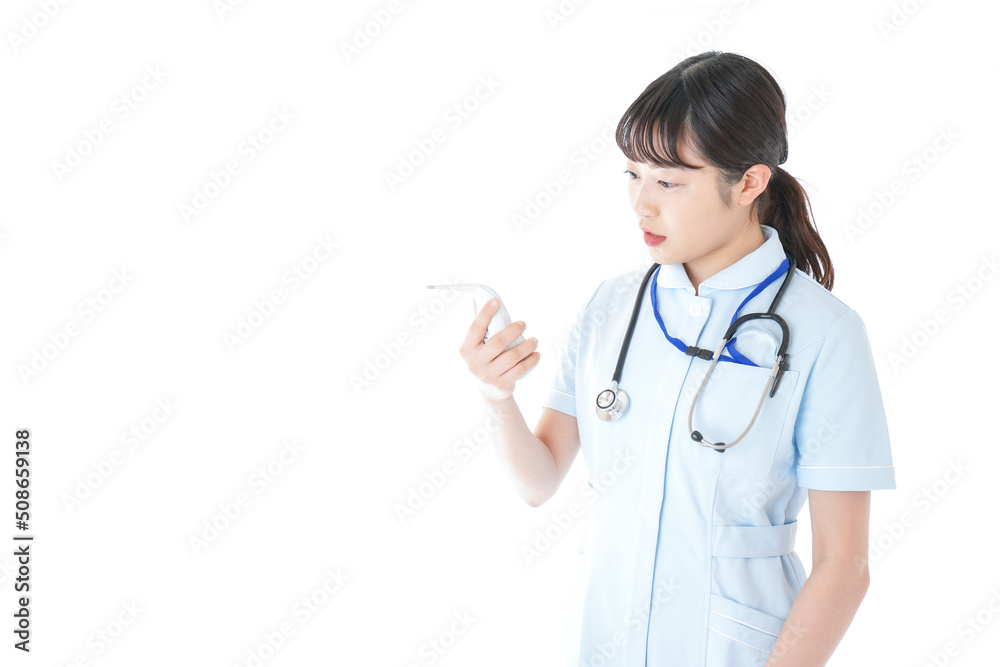 Young nurse measuring body temperature