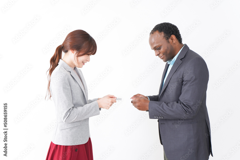 Two business person exchange business cards Two business person exchange business cards