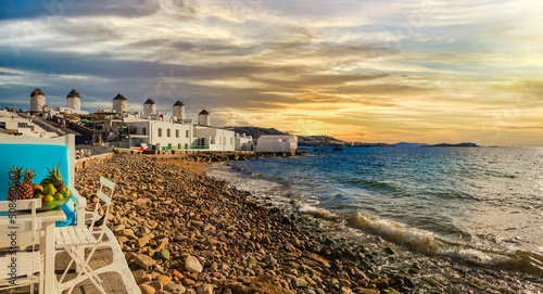 Mykonos island,Cyclades. Greece summer holidays. Sunset in the bar by the sea in famous popular place "Little Venice".