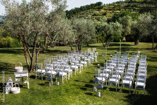 Outdoor wedding ceremony around the green mountains