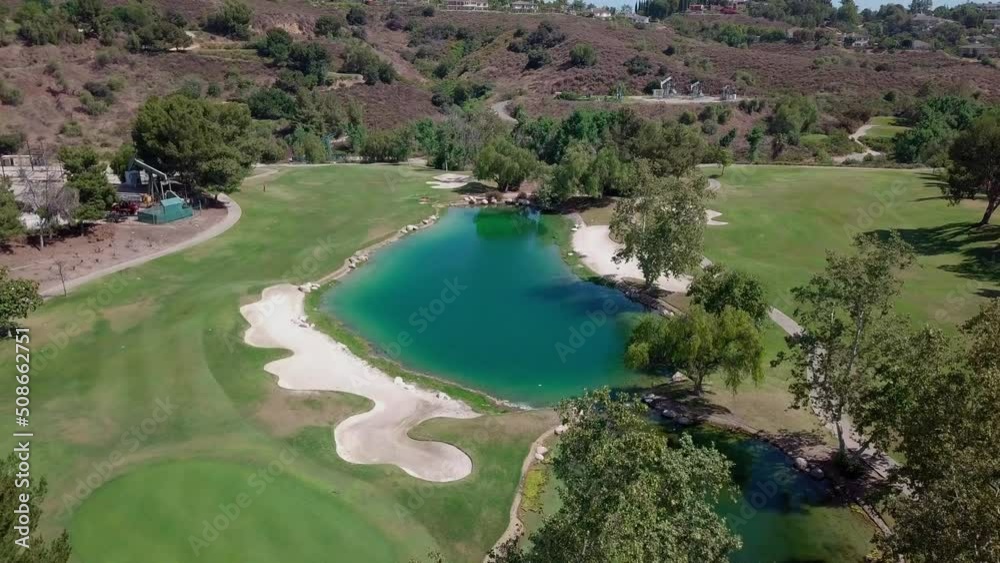 Aerial view of orange county golf course, California . Drone flies forward over golf course, United States. Aerial view of orange county golf course, California . Drone flies forward over golf course, United States.