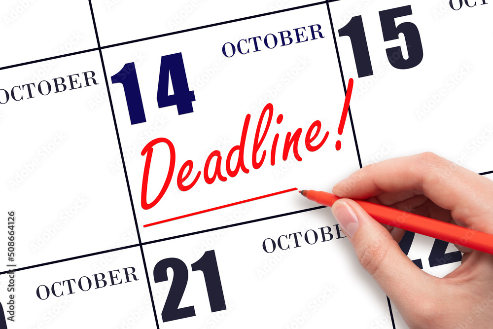 Hand drawing red line and writing the text Deadline on calendar date October 14. Deadline word written on calendar Hand drawing red line and writing the text Deadline on calendar date October 14. Deadline word written on calendar