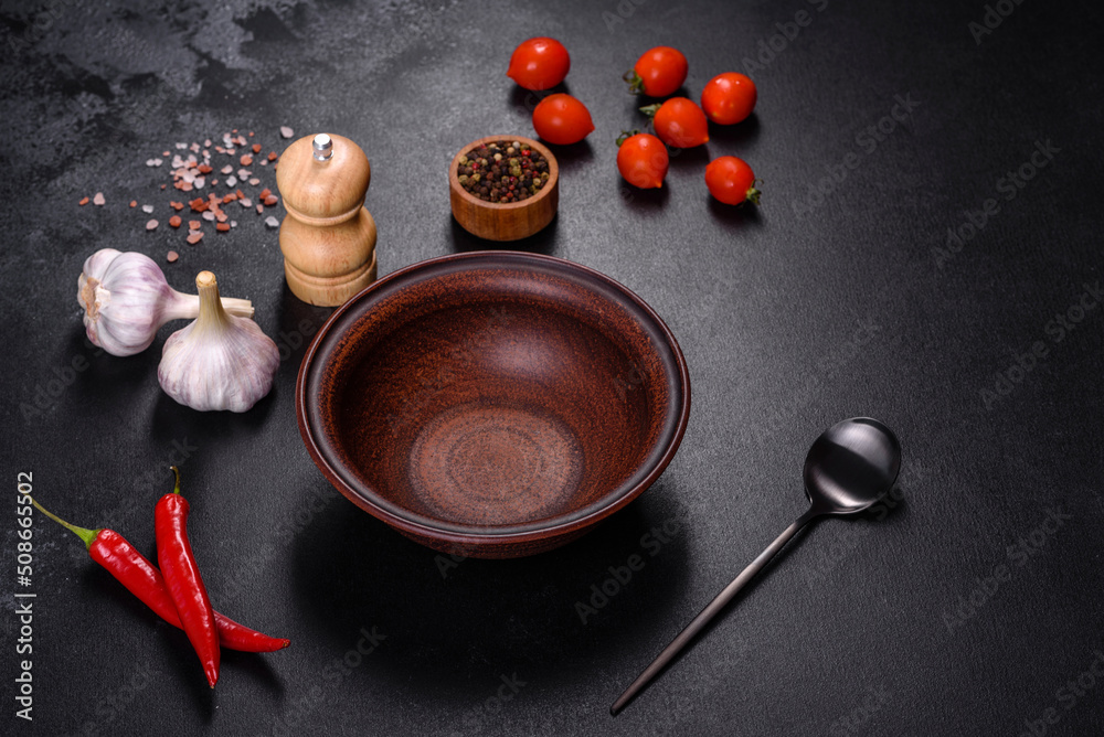 An empty plate with a knife, fork or spoon with a wooden cutting board An empty plate with a knife, fork or spoon with a wooden cutting board