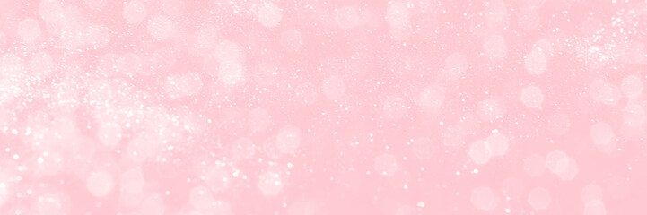 Pink sparkling glitter bokeh background, banner texture. Abstract defocused lights header. Wide screen wallpaper. Panoramic web banner with copy space for design
