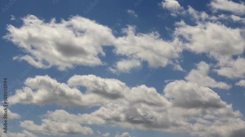 Rapid movement of white clouds. Timelapse of fast moving clouds. Fast moving and changing shape of clouds against a blue sky Rapid movement of white clouds. Timelapse of fast moving clouds. Fast moving and changing shape of clouds against a blue sky