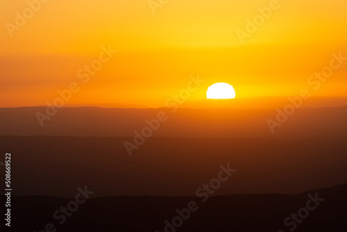 View of Mountains Ridges Layers with White Sun at Sunset Time in the Sierras de Cordoba,Argentina