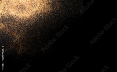 Festive dark background with golden sparkles. Creative copy space for seasonal projects and basis designs.