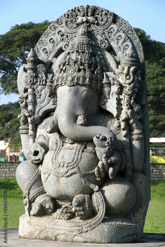 Huge stone Ganesha statue at western entrance of Hoysaleswara temple, Halebidu temple, Halebidu, Hassan District of Karnataka state, India. The temple was built in 12th-century rule of Hoysala Empire.