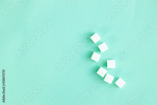 sugar cubes sweet food on color background. Diabet concept