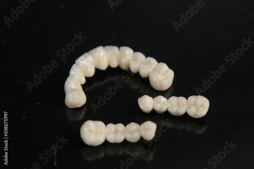 Fototapeta Naklejka Na Ścianę i Meble -  Metal free ceramic dental crowns. Dental ceramic bridge on isolated wite background