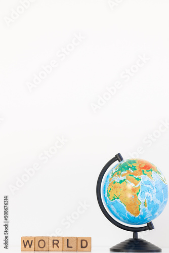 World word is written on wooden cubes on a white background. Closeup of wooden elements