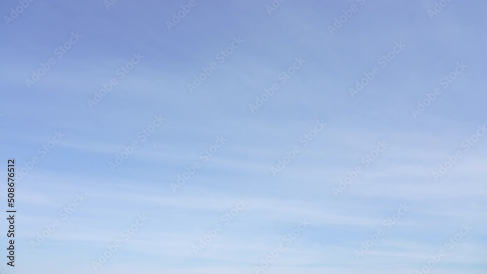 4k stock video timelapse of beautiful blue sky with soft white clouds isolated on sunny background. Beautiful sunlight and scenic colorful cloudscape. Natural abstract backdrop or wallpaper