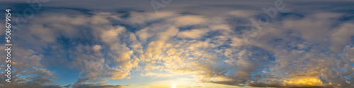 Panorama of a dark blue sunset sky with golden Cumulus clouds. Seamless hdr 360 panorama in spherical equiangular format. Full zenith for 3D visualization  sky replacement for aerial drone panoramas.