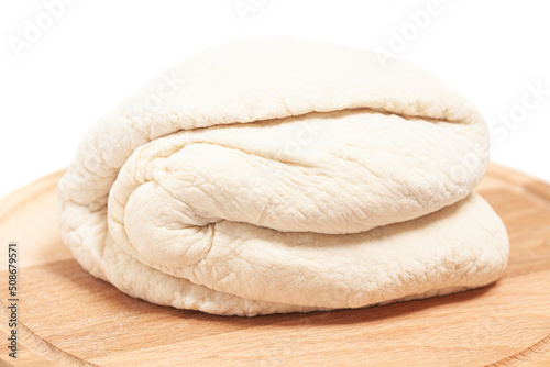 Fresh yeast dough on cutting board