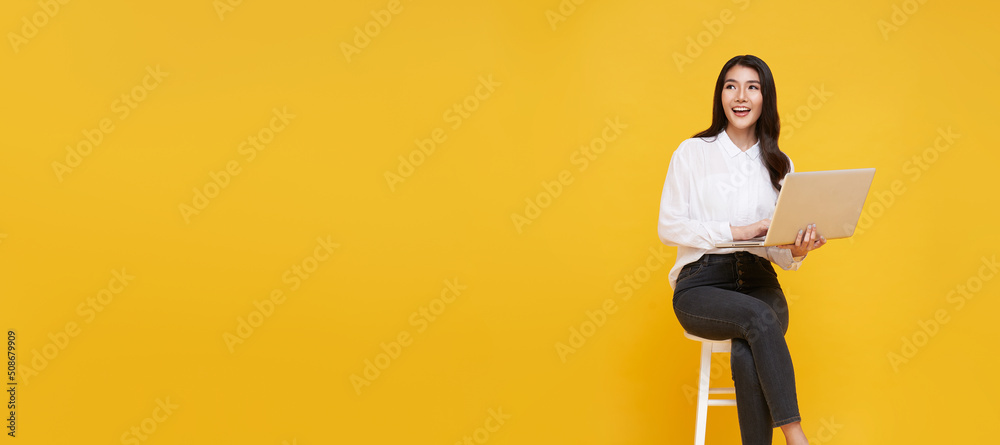 Young woman asian happy smiling. While her using laptop sitting on ...