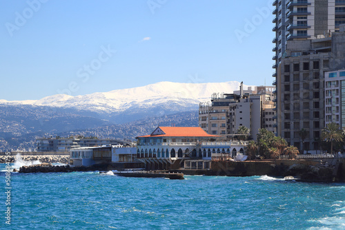 Beirut skyline with snow covered Mt Sannine in the background photo