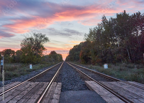 Magenta Sunset over a set of old railroad tracks