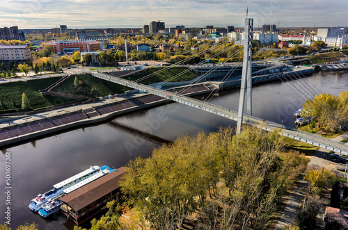 Pedestrian Lovers Bridge on Tura river. Tyumen photo