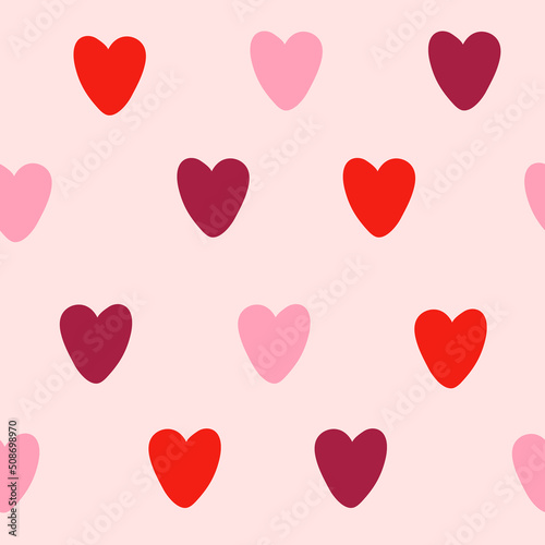 Simple heart half drop pattern in shades of red on pink. Vector seamless repeat for Valentines day, romantic, love projects