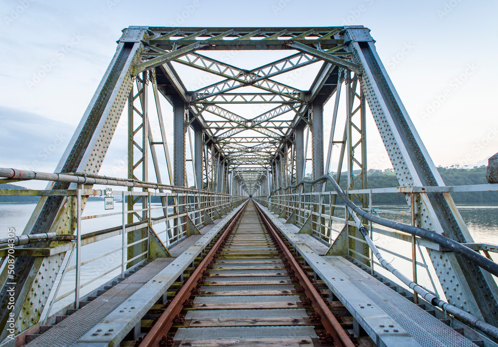 An old abandoned railway bridge during the sunset An old abandoned railway bridge during the sunset