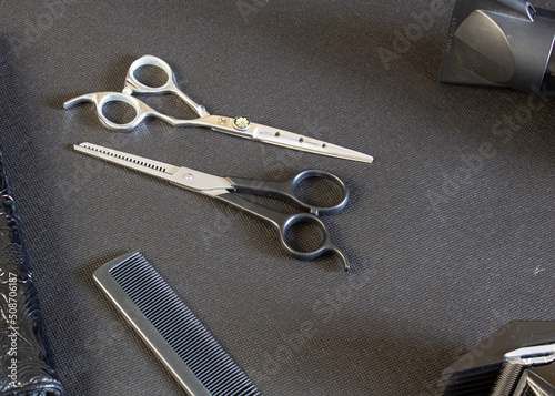 
hairdressing tool on a black background, strong plan