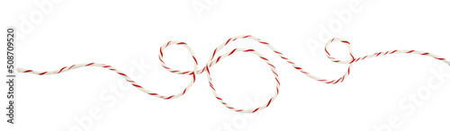 Print op canvas Curled white and red Christmas wrapping rope in a line arrangement isolated on w