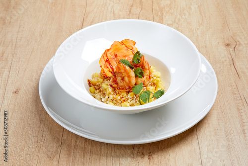 Yellow fried rice with shrimp and herbs