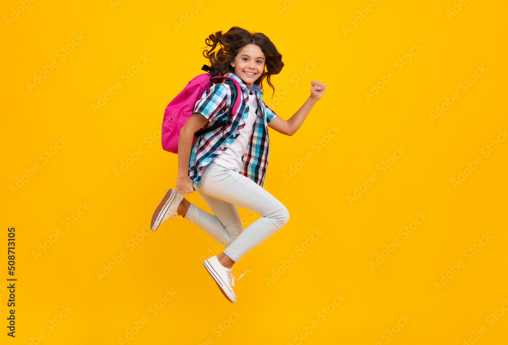 Amazed teen school girl. School teen with backpack. Teenager student, isolated background. Learning and knowledge. Go study. Education concept. Run and jump. Excited expression, cheerful and glad.