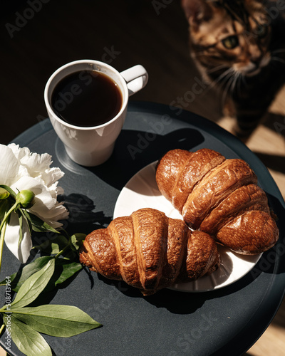 croissants with black coffee in the morning