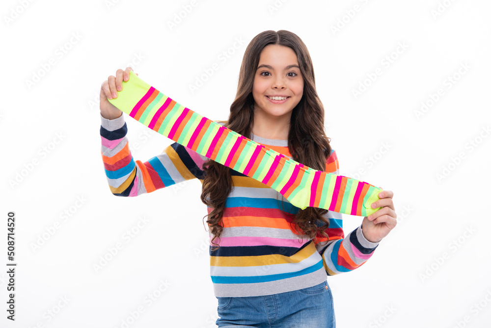Teen hold strip sock on white background. Child holding a pair of stripped socks. Teen hold strip sock on white background. Child holding a pair of stripped socks.