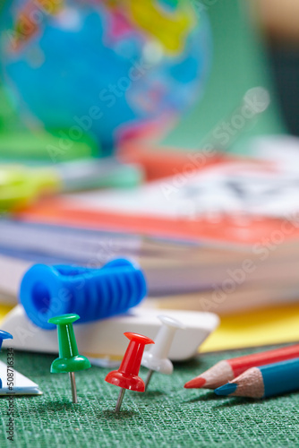 Back to school concept, school tools on the green background