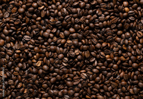 roasted coffee bean background throughout the frame 